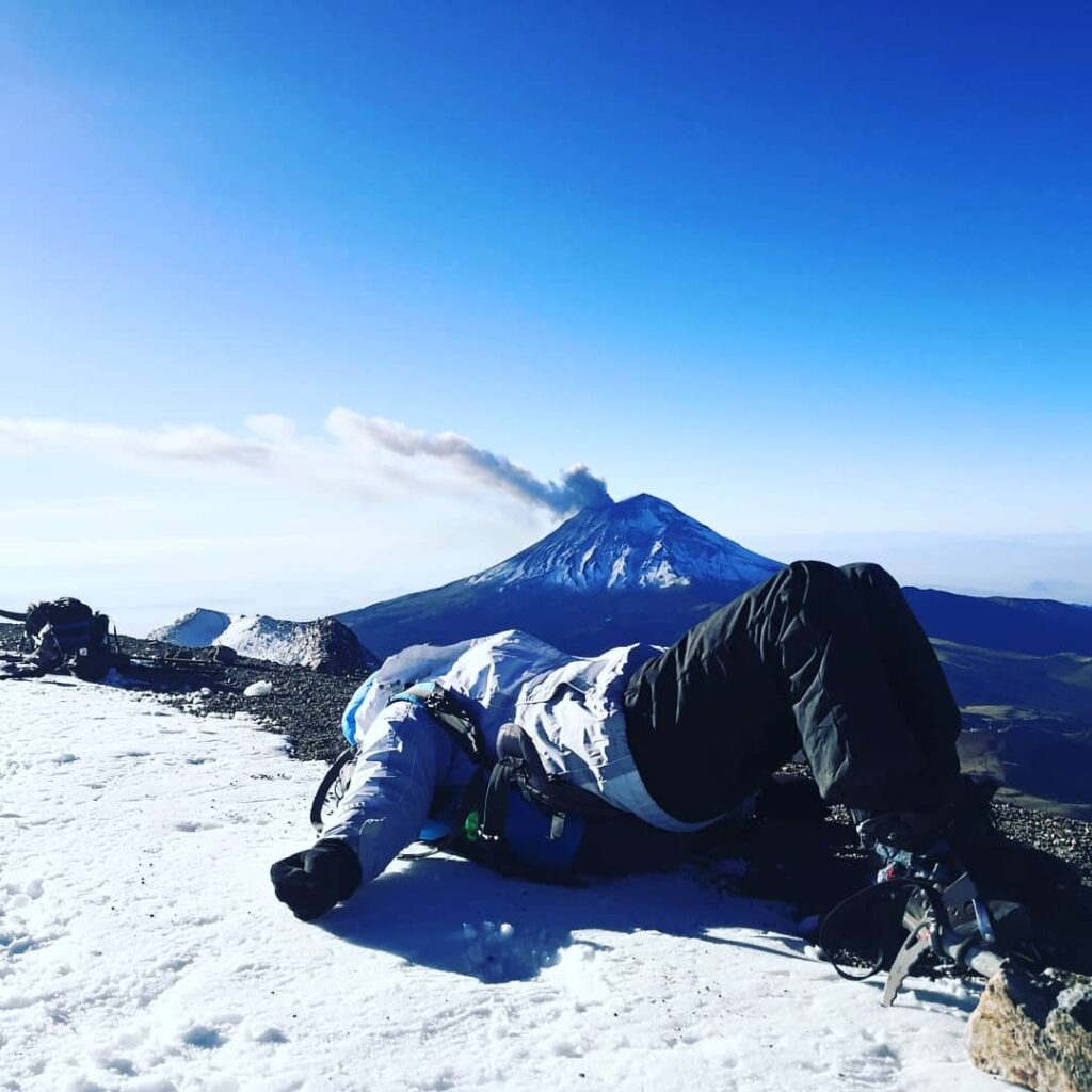 Popocatépetl with its plume, seen from the snowy summit of Iztaccíhuatl